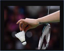 Player hitting a shuttlecock